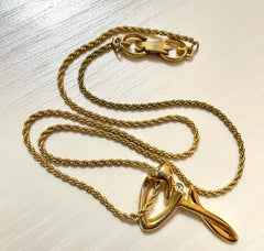 Vintage Givenchy golden chain necklace with g letter and crystal top. Classic jewelry that fits any occasion. 061127m1