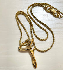 Vintage Givenchy golden chain necklace with g letter and crystal top. Classic jewelry that fits any occasion. 061127m1