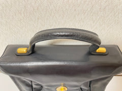 Vintage Bally black leather retro pop design bag, business purse with gold tone drawstrings and unique flap cut design. Unisex use. 160315