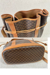 Vintage Celine hobo bucket shoulder bag in classic brown triomphe pattern with leather straps. 070218ys8