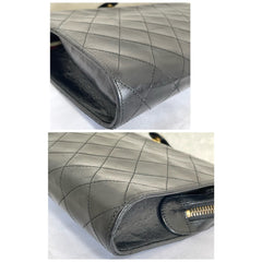 Vintage CHANEL black leather diary book design 2.55 flap shoulder bag with gold tone CC closure. 0407232