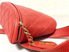 Vintage CHANEL red caviar leather waist bag, fanny pack purse with a matching leather belt and logo charm pull. 26” thru 28”. 070819ac2