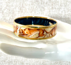 Vintage HERMES gold and brown tone and cloisonné/enamel bangle with rabbit, dog, and fox design. 070310ac2