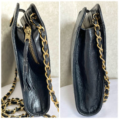 Vintage CHANEL black leather diary book design 2.55 flap shoulder bag with gold tone CC closure. 0407232
