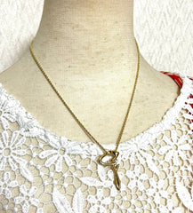 Vintage Givenchy golden chain necklace with g letter and crystal top. Classic jewelry that fits any occasion. 061127m1