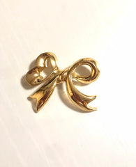 Vintage Nina Ricci golden bow brooch. Must have vintage jewelry piece back in the old era. 0406101
