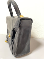 Vintage Bally black leather retro pop design bag, business purse with gold tone drawstrings and unique flap cut design. Unisex use. 160315