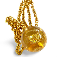 Vintage CHANEL long chain necklace with resin ball top, CC mark, turtle, camellia, clover, and 2.55 bag motifs in it. 060312ac4