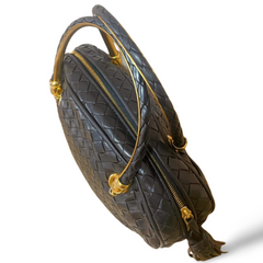 Vintage Bottega Veneta black intrecciato woven leather handbag with metal combo handles and a tassel. Rare masterpiece. 070822y1