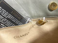 Vintage CHANEL taupe grey canvas and lambskin shoulder tote bag with gold tone chain straps and a CC ball charm. 070125ap1