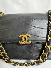 80's vintage Chanel black 2.55 shoulder bag with wavy stitches and rope strings and gold chain strap. Very rare piece from the era. 050730ra
