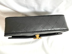 80's vintage Chanel black 2.55 shoulder bag with wavy stitches and rope strings and gold chain strap. Very rare piece from the era. 050730ra