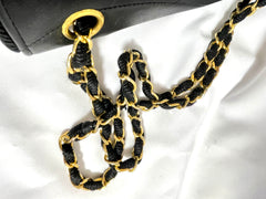 80's vintage Chanel black 2.55 shoulder bag with wavy stitches and rope strings and gold chain strap. Very rare piece from the era. 050730ra