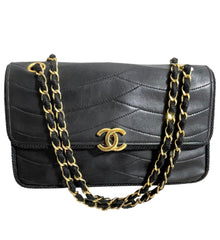 80's vintage Chanel black 2.55 shoulder bag with wavy stitches and rope strings and gold chain strap. Very rare piece from the era. 050730ra