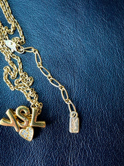 W3. Vintage Yves Saint Laurent golden YSL logo and heart crystal necklace. Must have jewelry piece. 050611ya