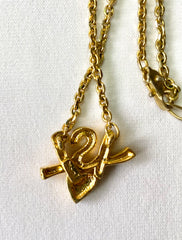 W3. Vintage Yves Saint Laurent golden YSL logo and heart crystal necklace. Must have jewelry piece. 050611ya