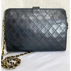 Vintage CHANEL black leather diary book design 2.55 flap shoulder bag with gold tone CC closure. 0407232
