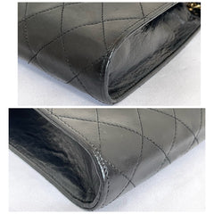 Vintage CHANEL black leather diary book design 2.55 flap shoulder bag with gold tone CC closure. 0407232