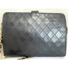 Vintage CHANEL black leather diary book design 2.55 flap shoulder bag with gold tone CC closure. 0407232