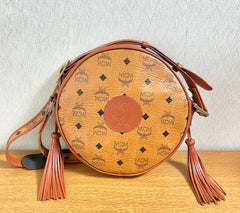 Vintage MCM brown monogram round Suzy Wong shoulder bag with brown leather trimmings. Designed by Michael Cromer. Unisex. 050715ya1