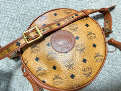 Vintage MCM brown monogram round Suzy Wong shoulder bag with brown leather trimmings. Designed by Michael Cromer. Unisex. 050715ya1