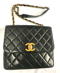 Vintage Chanel classic large black lambskin 2.55 square shape chain shoulder bag with golden large CC closure. Must have purse. 0404081