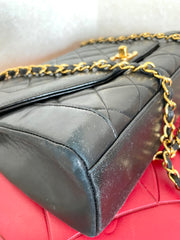 Vintage Chanel black lambskin chain 2.55 shoulder bag with gold chain. Unique hexagon shaped flap. 0407012