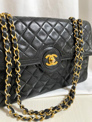 80's vintage Chanel black 2.55 shoulder bag with circle CC flap design. Rare piece from the era. 0410283