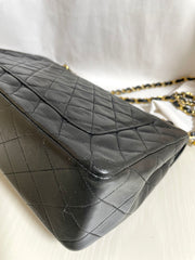 80's vintage Chanel black 2.55 shoulder bag with circle CC flap design. Rare piece from the era. 0410283