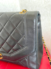 Vintage Chanel black lambskin chain 2.55 shoulder bag with gold chain. Unique hexagon shaped flap. 0407012