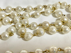 Vintage CHANEL faux pearl necklace, extra long necklace with golden round logo motif. Must have classic jewelry piece. 0408152