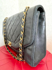 Vintage Chanel black lambskin chain 2.55 shoulder bag with gold chain. Unique hexagon shaped flap. 0407012