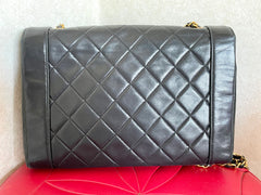 Vintage Chanel black lambskin chain 2.55 shoulder bag with gold chain. Unique hexagon shaped flap. 0407012