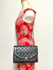 Vintage Chanel black lambskin chain 2.55 shoulder bag with gold chain. Unique hexagon shaped flap. 0407012