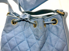 Vintage CHANEL blue quilted canvas and leather combo hobo bucket shoulder bag with drawstrings and golden CC mark balls. 060905r3
