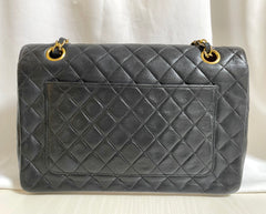 80's vintage Chanel black 2.55 shoulder bag with circle CC flap design. Rare piece from the era. 0410283