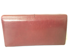 Vintage Bally wine leather clutch bag, party and classic purse with gold tone logo motif.