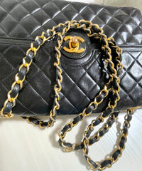 80's vintage Chanel black 2.55 shoulder bag with circle CC flap design. Rare piece from the era. 0410283