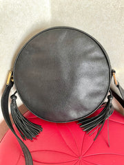 Vintage MCM black suzy wong, grained leather round shoulder bag with golden logo studs and fringes. Designed by Michael Cromer.0407051