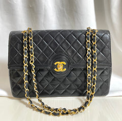 80's vintage Chanel black 2.55 shoulder bag with circle CC flap design. Rare piece from the era. 0410283