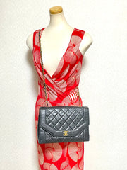 Vintage Chanel black lambskin chain 2.55 shoulder bag with gold chain. Unique hexagon shaped flap. 0407012