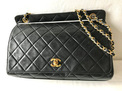 Vintage Chanel black leather 2.55 chain large shoulder bag with white trimming edge and a matching pouch. 0403284