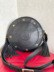 Vintage MCM black suzy wong, grained leather round shoulder bag with golden logo studs and fringes. Designed by Michael Cromer.0407051