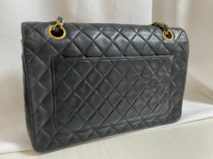 80's vintage Chanel black 2.55 shoulder bag with circle CC flap design. Rare piece from the era. 0410283