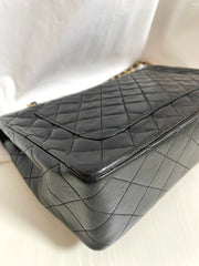 80's vintage Chanel black 2.55 shoulder bag with circle CC flap design. Rare piece from the era. 0410283