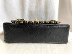 80's vintage Chanel black 2.55 shoulder bag with circle CC flap design. Rare piece from the era. 0410283