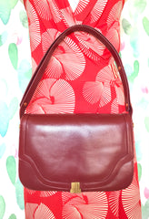Vintage Lanvin wine leather shoulder bag with golden logo motif closure. Classic must have purse. 060620r2