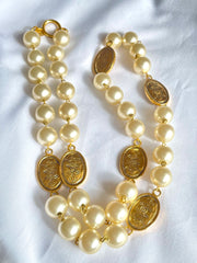 Vintage CHANEL classic faux pearl necklace with oval CC coin charms. 041205bs7