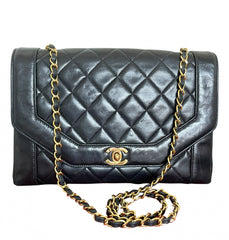 Vintage Chanel black lambskin chain 2.55 shoulder bag with gold chain. Unique hexagon shaped flap. 0407012