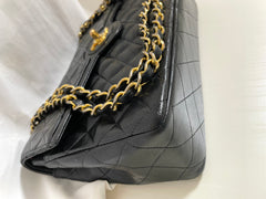80's vintage Chanel black 2.55 shoulder bag with circle CC flap design. Rare piece from the era. 0410283